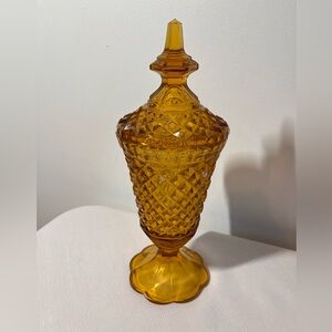Vintage Indiana Glass lidded apothecary jar marigold amber glass diamond point.